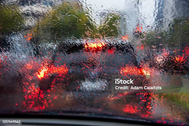 Looking Through A Wet Drivers Window At Traffic Stock Photo - Download Image Now - Rain, Storm, Looking Through Window