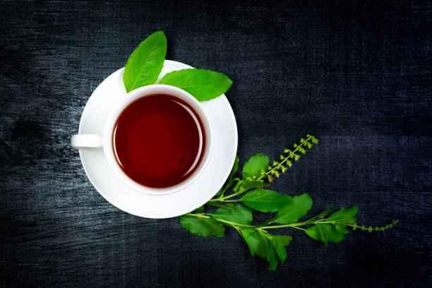 istock Tulsi or holy basil tea in white cup 1317455887