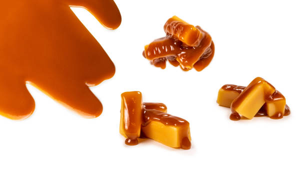 istock Tasty caramel candy isolated on white background. 1317456572