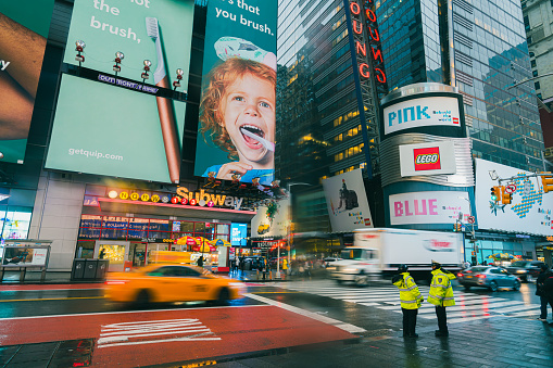 Timesquare Newyork,United States Dec 2 2019:Crowded tourist people, vehicel traffic coummuter and advertising billboards neon displaying