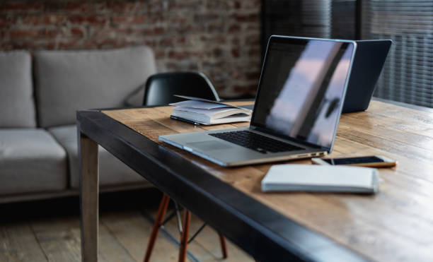 istock Laptop with screen on the table in the office, phone and notebooks 1317458659