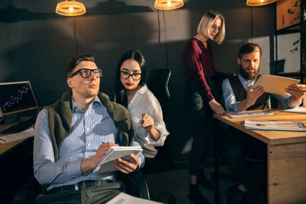 istock Colleagues working together in modern office using devices and gadgets during creative meeting 1317459420