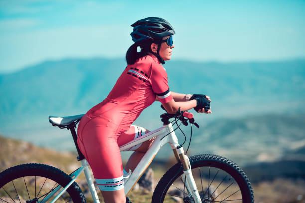 istock Female Cyclist Enjoying Mountain View While Mountain Biking 1317460133