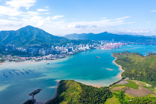 Historic photo of the British Colonial Hong Kong. Circa 1971. The view from Victoria Peak of the skyline of the island of Hong Kong, the Victoria Harbor and the Kowloon peninsula in the background.