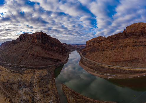 Colorado River and Red Sandstone Mountains on Cloudy Morning. Sky Reflection in Water. Grand County, Utah, USA. Aerial View.