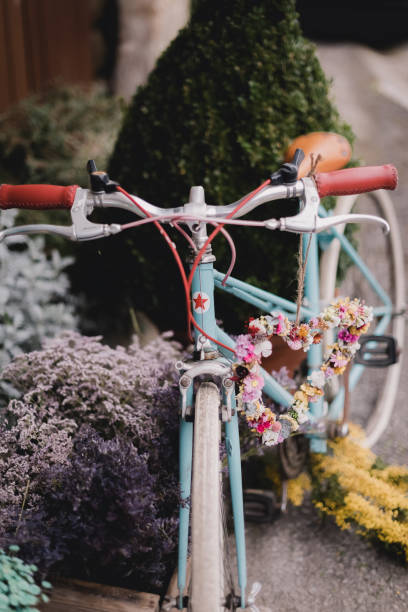istock Bicycle decorated with flowers in a garden 1317462115
