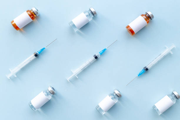 istock Medical vials with vaccine. Vaccination concept 1317464443