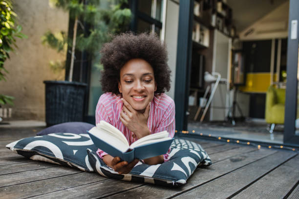 istock Relaxing at home on the balcony and reading a book 1317465783