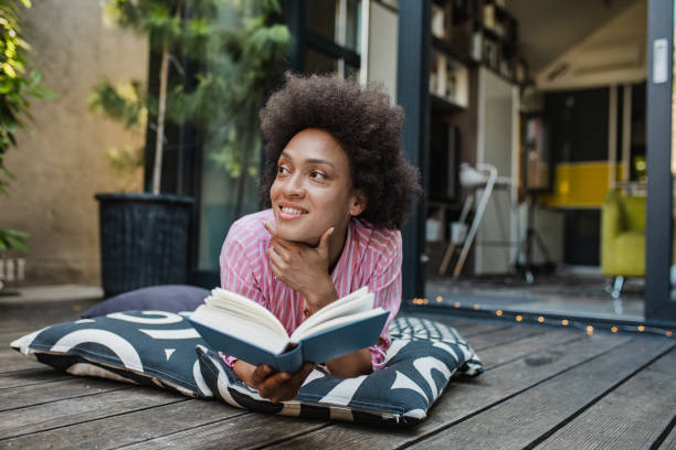 istock Relaxing at home on the balcony and reading a book 1317466373