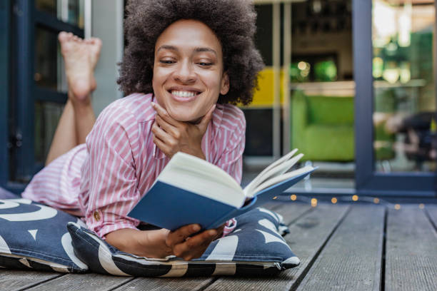 istock Relaxing at home on the balcony and reading a book 1317466478