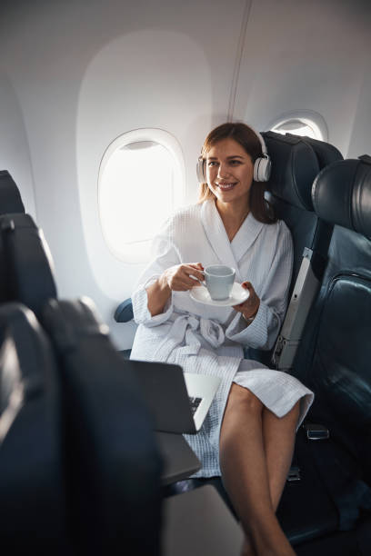 istock Positive plane passenger putting cup on saucer 1317469214