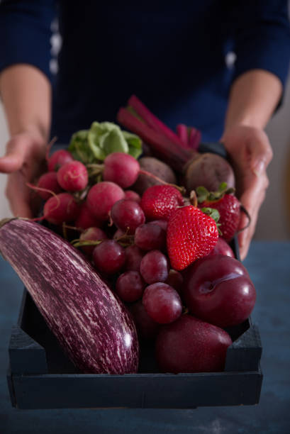 istock Fresh vegetables and fruits in reddish tones. 1317469329