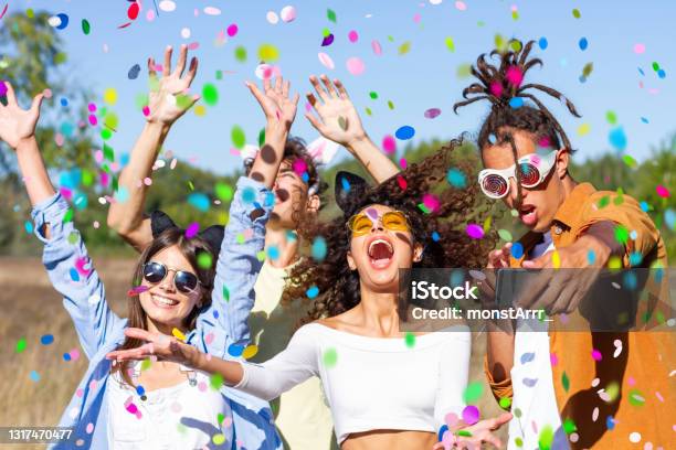Young Friends Enjoying Summer Time Together Celebrating At Birthday Party Stock Photo - Download Image Now