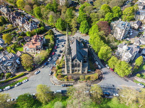 Aerial view of a church building and residential housing in the city centre of Harrogate, North Yorkshire, England. Taken with class A1 drone.