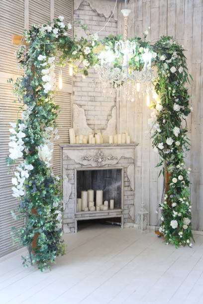 istock Interior with decorative flowers and a fireplace 1317471954