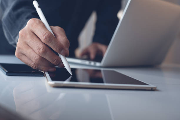 istock Business man working on laptop in modern office 1317473232