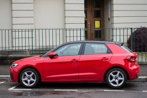 Mulhouse - France - 11 May 2021 - Profile view of red Audi A1 parked in the street