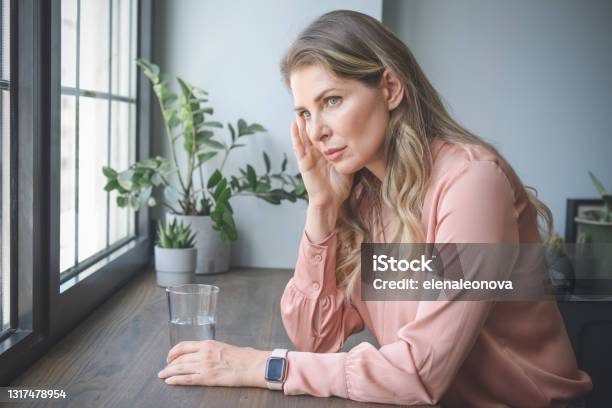 Attractive Middle Aged Woman In The Office Stock Photo - Download Image Now