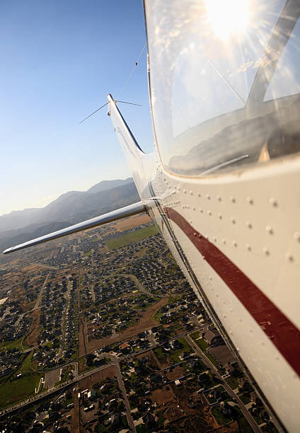 istock Airplane Flying Over City 131748003