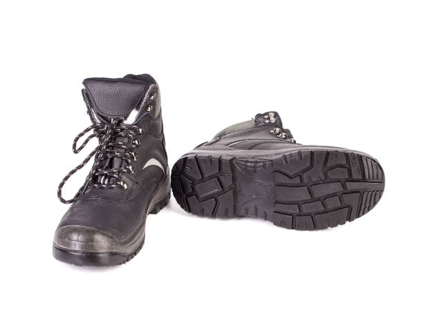 istock Black man's boots with gray bar. 1317485627