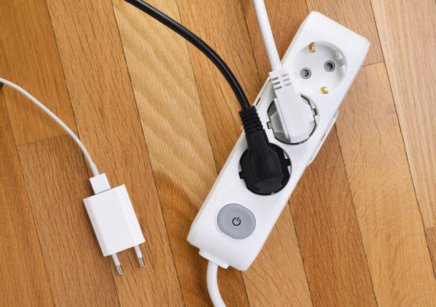 istock White extension cord with three outlets. Power strip with switch for home or office. 1317486885