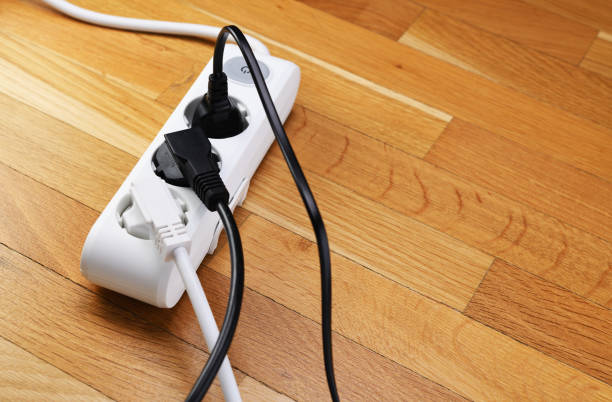 istock White extension cord with three outlets. Power strip with switch for home or office. 1317487068