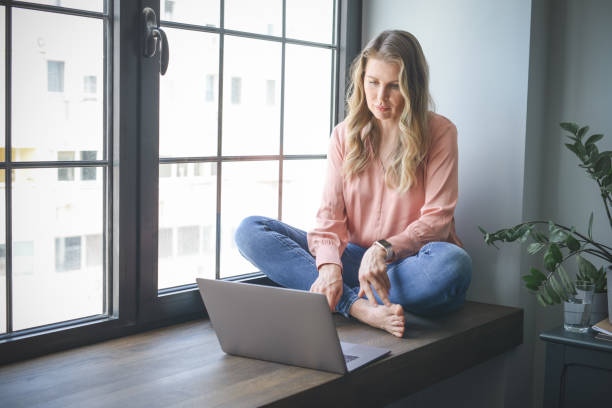 istock attractive middle aged woman working in the office ( with laptop) 1317488332