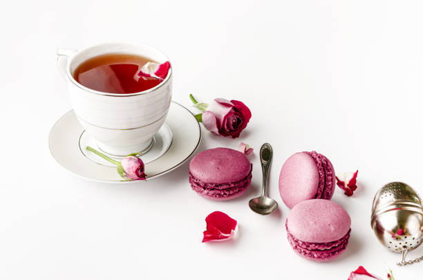 istock Cup of tea with macarons and roses 1317491177