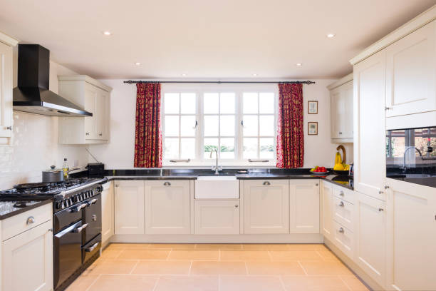 istock Shaker style farmhouse kitchen, painted wood UK kitchen interior 1317491251