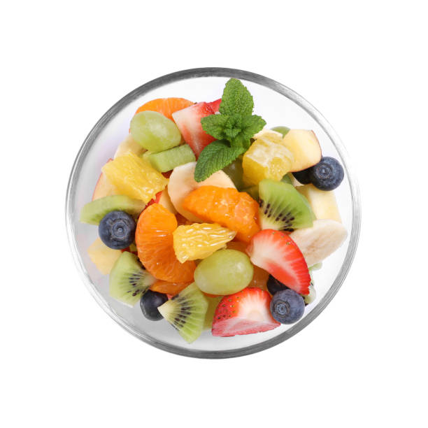 istock Delicious fresh fruit salad in bowl on white background, top view 1317491465