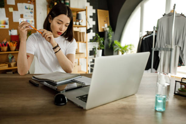 istock Young woman sitting in her desk and studying for a test 1317492223