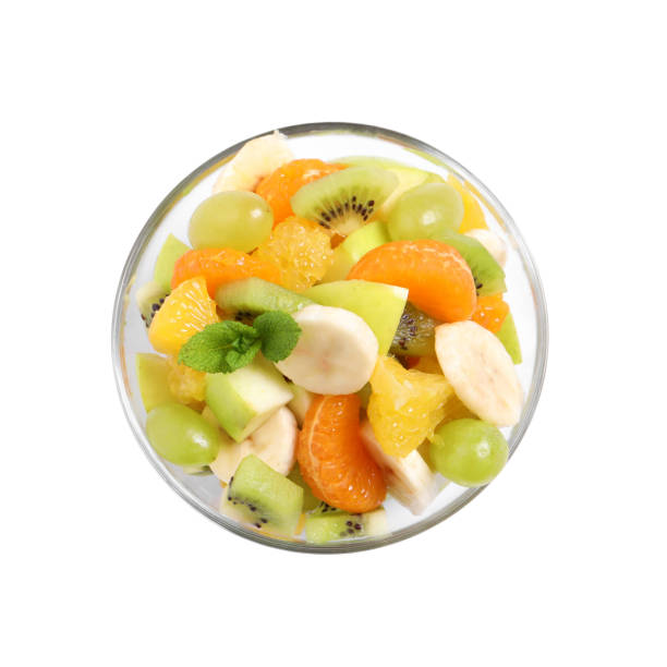istock Delicious fresh fruit salad in bowl on white background, top view 1317492305