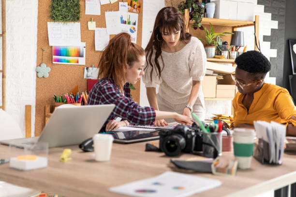 istock Creative female colleagues collaborating on a project together 1317492907