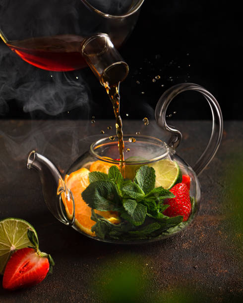 istock Hot tea drink with oranges, strawberry and mint in a teapot 1317493562