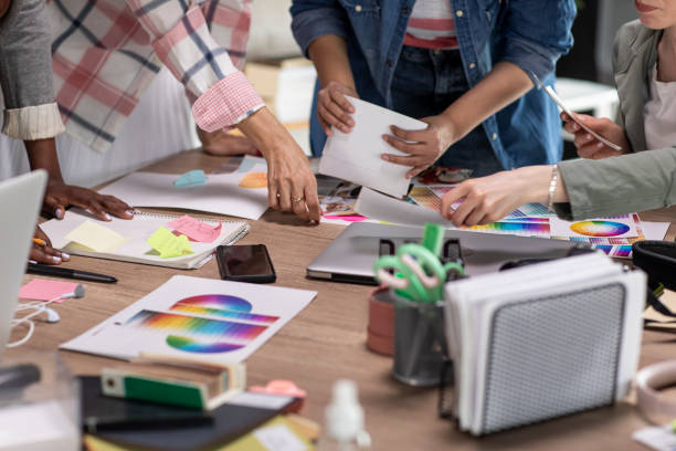 istock Female photographers sorting photographs in their studio 1317493944
