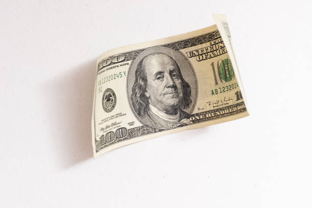 istock American bank notes isolated on the white background 1317494044