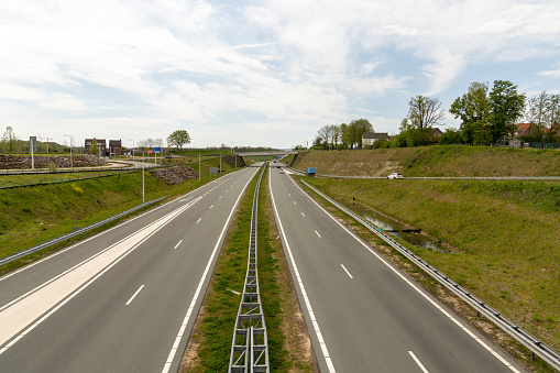 A clean and modern highway in the southern Netherlands with very little traffic