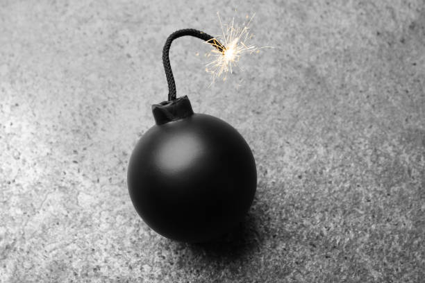 One man, masked terrorist making a dynamite in dark workshop alone.