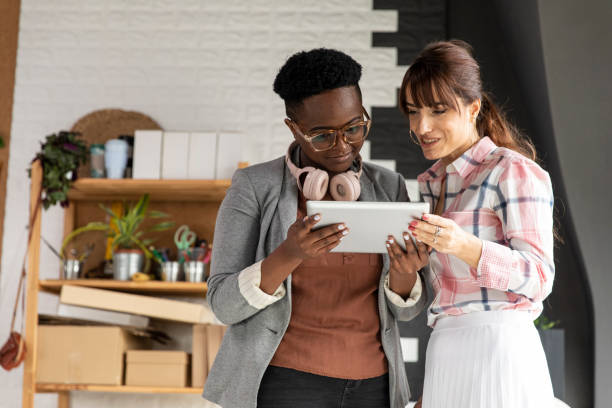 istock Two creative female entrepreneurs watching a video on digital tablet 1317496759