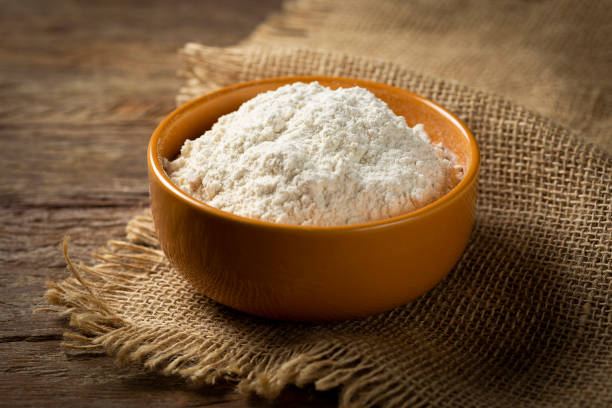 istock Bowl with wheat flour on the table. 1317497070