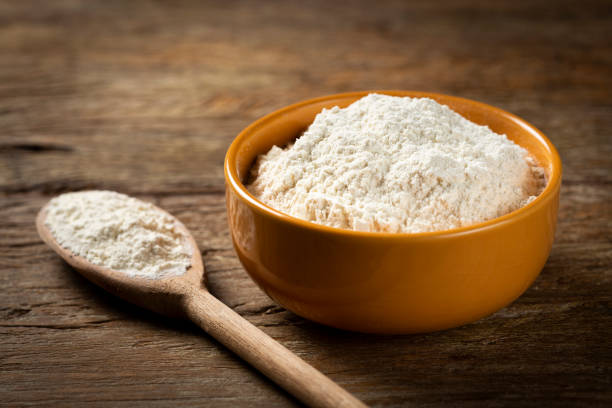 istock Bowl with wheat flour on the table. 1317497085