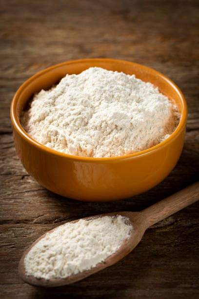 istock Bowl with wheat flour on the table. 1317497086
