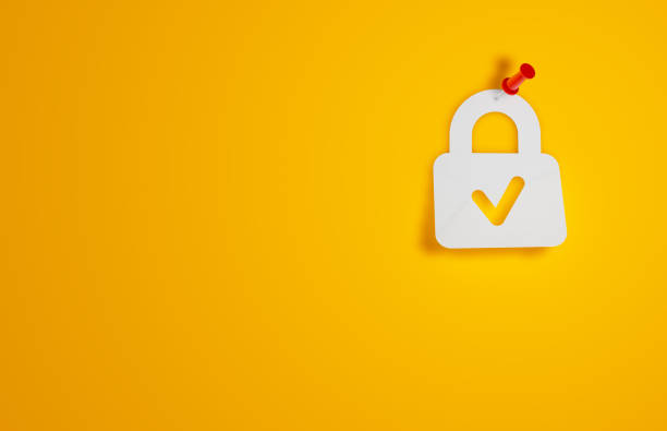 Pin Paper Padlock Symbol on Yellow Background Pin Paper Padlock Symbol on Yellow Background keyhole photos stock pictures, royalty-free photos & images