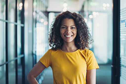 Young businesswoman standing in the corridor