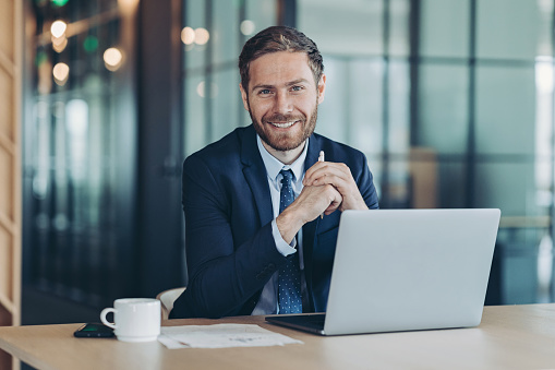 Portrait of a young businessman standing in the office