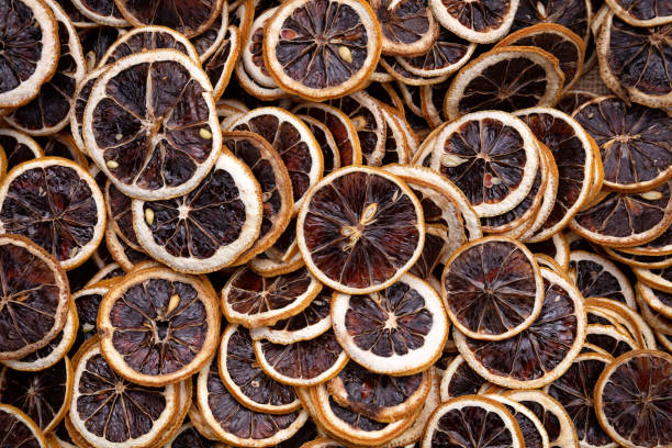 Full frame dried lemon slices. Stock Photo.