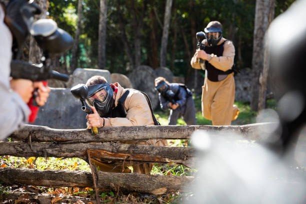 istock Men and women playing paintball 1317500690