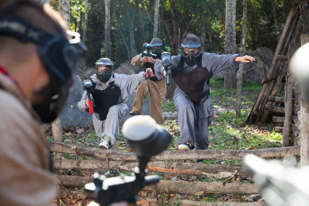 istock People in full gear playing paintball 1317500755
