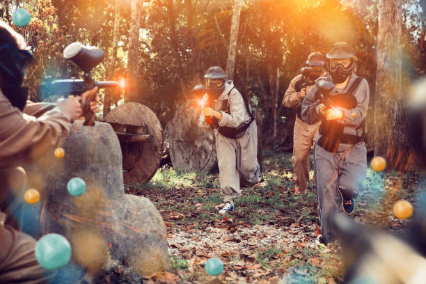 istock Teams playing paintball outdoors 1317500757