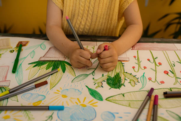 istock Girl drawing plants at home 1317502511